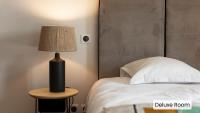 Hôtel l'Arena客房内的一张或多张床位