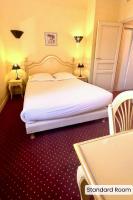 Hôtel l'Arena客房内的一张或多张床位