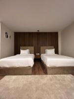 The Home Boutique Hotel Pyramids Inn客房内的一张或多张床位
