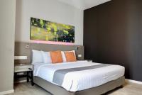 Qliq Damansara Hotel客房内的一张或多张床位