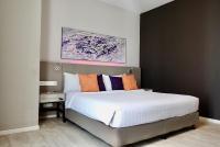 Qliq Damansara Hotel客房内的一张或多张床位