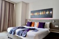 Qliq Damansara Hotel客房内的一张或多张床位