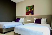 Qliq Damansara Hotel客房内的一张或多张床位