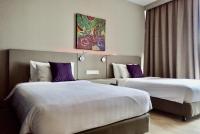 Qliq Damansara Hotel客房内的一张或多张床位