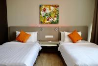 Qliq Damansara Hotel客房内的一张或多张床位
