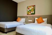 Qliq Damansara Hotel客房内的一张或多张床位