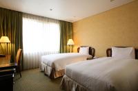 International Resort Hotel Yurakujo客房内的一张或多张床位