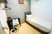 QQ Seremban Lovely HomeStay10R 4B客房内的一张或多张床位