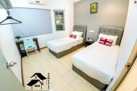 QQ Seremban Lovely HomeStay10R 4B客房内的一张或多张床位