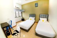 QQ Seremban Lovely HomeStay10R 4B客房内的一张或多张床位