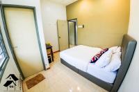QQ Seremban Lovely HomeStay10R 4B客房内的一张或多张床位