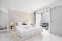 Cycladic Suites & Spa客房内的一张或多张床位
