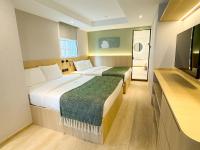 Urbanwood Hung Hom客房内的一张或多张床位