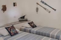 LA CASETA, Gîte 4 étoiles entre mer et lac marin客房内的一张或多张床位