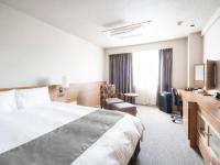 Vessel Inn Fukuyama Station客房内的一张或多张床位