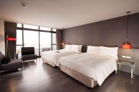 Ramada Encore By Wyndham Hualien客房内的一张或多张床位
