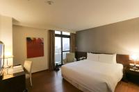 Ramada Encore By Wyndham Hualien客房内的一张或多张床位