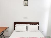 Sea View Condo by Ceylon Spaces客房内的一张或多张床位