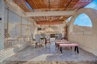 Villa Khufu Pyramids Hotel餐厅或其他用餐的地方