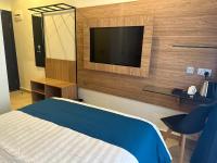 Hotelinn Oniru客房内的一张或多张床位
