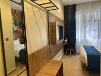 Hotelinn Oniru客房内的一张或多张床位