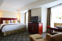 International Resort Hotel Yurakujo客房内的一张或多张床位
