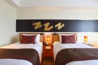 International Resort Hotel Yurakujo客房内的一张或多张床位