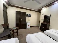 SAFIR BAGHDAD HoTEL客房内的一张或多张床位