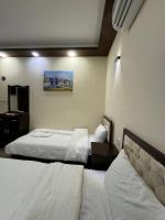 SAFIR BAGHDAD HoTEL客房内的一张或多张床位