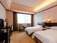 Vienna International Hotel Shenzhen North Station Branch的电视和/或娱乐中心