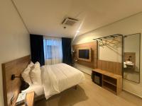 Hotelinn Oniru客房内的一张或多张床位
