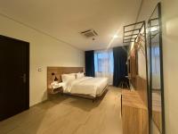 Hotelinn Oniru客房内的一张或多张床位