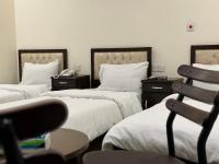 SAFIR BAGHDAD HoTEL客房内的一张或多张床位