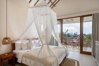 The Kailas Ubud客房内的一张或多张床位