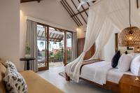 The Kailas Ubud客房内的一张或多张床位