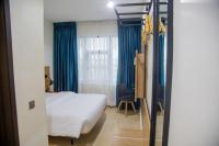 Hotelinn Oniru客房内的一张或多张床位