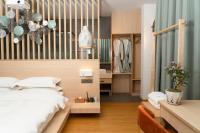 Aishe Honeymoon Erhai Lake Sea View Guesthouse客房内的一张或多张床位