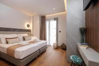 Jolly Suites客房内的一张或多张床位
