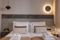 Jolly Suites客房内的一张或多张床位