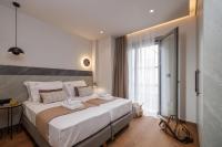 Jolly Suites客房内的一张或多张床位