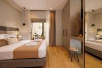Jolly Suites客房内的一张或多张床位
