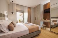 Jolly Suites客房内的一张或多张床位