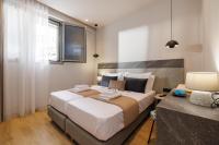 Jolly Suites客房内的一张或多张床位