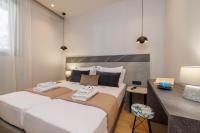 Jolly Suites客房内的一张或多张床位