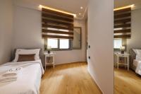 Jolly Suites客房内的一张或多张床位