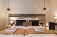 Jolly Suites客房内的一张或多张床位