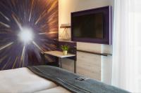 Holiday Inn - the niu, Air Frankfurt Messe by IHG的电视和/或娱乐中心