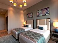 Rixos The Palm Hotel &amp; Suites - Ultra All Inclusive客房内的一张或多张床位