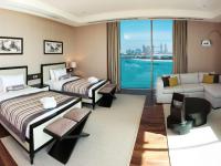 Rixos The Palm Hotel &amp; Suites - Ultra All Inclusive客房内的一张或多张床位