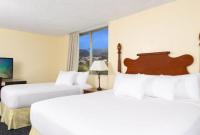 Ohia Waikiki Studio Suites客房内的一张或多张床位